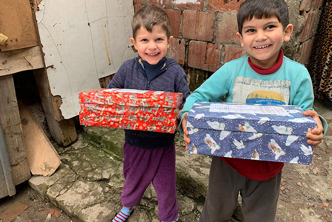 2-young-boys-with-shoeboxes-no